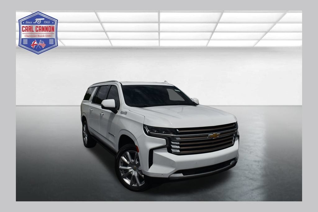 2021 Chevrolet Suburban High Country in Summit White — front three-quarter view
